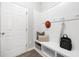 This mudroom features custom storage, seating and white trim at 131 Explorer Dr # 257, Morrisville, NC 27560