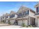 Attractive street view of newly constructed townhomes with neutral siding and well-maintained landscaping at 131 Explorer Dr # 257, Morrisville, NC 27560