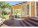Back patio with furniture; enjoy outdoor living with a view of the home's backyard and greenery at 132 Lord Ashley Rd, Raleigh, NC 27610