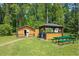 Backyard area featuring an outbuilding, gazebo, and a picnic table at 132 Lord Ashley Rd, Raleigh, NC 27610