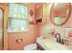 Bathroom featuring a vanity with sink, toilet, and an oval mirror above sink at 132 Lord Ashley Rd, Raleigh, NC 27610