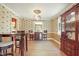 Dining room with decorative wallpaper, wood floors, furniture, and natural light at 132 Lord Ashley Rd, Raleigh, NC 27610