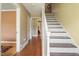 Bright entryway featuring terracotta tile floors and stairs leading to the second level at 132 Lord Ashley Rd, Raleigh, NC 27610