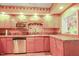 Classic kitchen with wooden cabinets, stainless steel appliances, granite countertops, and natural light at 132 Lord Ashley Rd, Raleigh, NC 27610