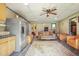 Spacious room with a retro vibe, kitchen, plenty of seating and a unique rug at 132 Lord Ashley Rd, Raleigh, NC 27610
