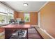 Sunlit office features hardwood floors, neutral paint, multiple windows, and a large work desk at 132 Lord Ashley Rd, Raleigh, NC 27610