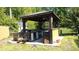 Outdoor kitchen featuring a grill, storage, and countertop space for outdoor cooking at 132 Lord Ashley Rd, Raleigh, NC 27610