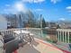 Spacious back deck with a gas grill, dining table, seating, and ample space for outdoor entertaining at 132 Mantle Dr, Clayton, NC 27527