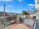 Back deck featuring a wood pellet grill, chairs, and an exterior rug at 132 Mantle Dr, Clayton, NC 27527