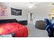 Nicely decorated bedroom with a black dresser, beanbag chair, and unique wall decor at 132 Mantle Dr, Clayton, NC 27527