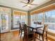 Dining room featuring a large wooden table with seating and natural light from large windows at 132 Mantle Dr, Clayton, NC 27527