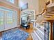Grand foyer with hardwood floors, a staircase, and an open view into other rooms at 132 Mantle Dr, Clayton, NC 27527