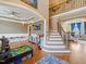 Welcoming foyer featuring staircase and adjacent living area at 132 Mantle Dr, Clayton, NC 27527