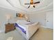 Inviting main bedroom featuring a trey ceiling, nightstands, and plush bedding at 132 Mantle Dr, Clayton, NC 27527