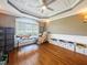 Charming playroom with hardwood floors and a large window providing ample natural light at 132 Mantle Dr, Clayton, NC 27527