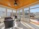 Relaxing sun room with a wood plank ceiling and comfortable seating, perfect for entertaining or enjoying a quiet day at 132 Mantle Dr, Clayton, NC 27527