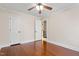 Bright bedroom featuring a ceiling fan, hardwood floors, and fresh white trim at 1408 Hunters Point Way, Cary, NC 27511