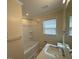 Clean bathroom featuring a shower-tub combo, tile flooring, and a modern vanity at 1421 Deer Crossing Ct, Henderson, NC 27536