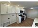 Spacious kitchen with stainless steel appliances, white cabinets, and a utility area at 1421 Deer Crossing Ct, Henderson, NC 27536