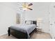 Cozy bedroom features neutral decor, ceiling fan, and natural light from the window at 1500 Allen Ln, Hillsborough, NC 27278