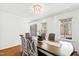Bright and airy dining room with a decorative chandelier and natural light, perfect for gatherings at 1500 Allen Ln, Hillsborough, NC 27278
