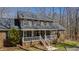 Charming two-story brick home with a welcoming front porch and well-maintained landscaping at 1500 Allen Ln, Hillsborough, NC 27278