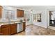 Modern kitchen with stainless steel dishwasher and natural light, ideal for cooking and entertaining at 1500 Allen Ln, Hillsborough, NC 27278