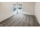 Bedroom with neutral gray carpet, white walls, and wood trim windows at 1501 Copper Cir, Mebane, NC 27302