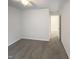 Bedroom with neutral gray carpet, white walls, a ceiling fan, and an open door at 1501 Copper Cir, Mebane, NC 27302