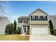Charming two-story home featuring a two-car garage, well-maintained lawn, and welcoming entrance at 1501 Copper Cir, Mebane, NC 27302