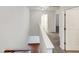 Upstairs hallway with both hardwood and carpet flooring and white walls at 1501 Copper Cir, Mebane, NC 27302