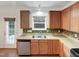 Classic kitchen with stainless appliances and stylish mosaic backsplash at 1501 Copper Cir, Mebane, NC 27302