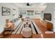 Bright living room with large windows, neutral decor, and hardwood floors at 1501 Copper Cir, Mebane, NC 27302