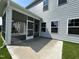 Screened porch opens to concrete patio and fenced in backyard at 1560 Bright Coral Trl, Wendell, NC 27591