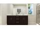 Elegant bathroom featuring a double vanity, large mirror, and glass-enclosed shower at 1560 Bright Coral Trl, Wendell, NC 27591