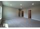Large, carpeted primary bedroom with neutral walls and recessed lighting at 1560 Bright Coral Trl, Wendell, NC 27591
