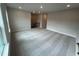 Spacious carpeted bonus room with recessed lighting and staircase at 1560 Bright Coral Trl, Wendell, NC 27591