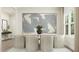 Elegant dining room with neutral chairs, modern art, and large windows at 1560 Bright Coral Trl, Wendell, NC 27591