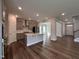 Modern open-concept kitchen with a center island and stainless steel appliances at 1560 Bright Coral Trl, Wendell, NC 27591