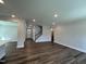 Bright living room features recessed lighting, hardwood floors, and an open floor plan at 1560 Bright Coral Trl, Wendell, NC 27591