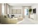 Bright living room with large windows, comfortable seating, and modern decor at 1560 Bright Coral Trl, Wendell, NC 27591