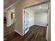 Office featuring hardwood floors, white trim, and glass panel doors at 1560 Bright Coral Trl, Wendell, NC 27591