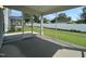 View of the screened in porch and fenced in backyard with lawn at 1560 Bright Coral Trl, Wendell, NC 27591