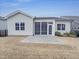 Backyard with a screened-in porch and stone patio at 157 Auburn Village Blvd, Raleigh, NC 27610