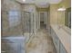 Elegant bathroom features a glass-enclosed shower, double vanity, and tasteful tile work at 157 Auburn Village Blvd, Raleigh, NC 27610