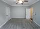 Unfurnished bedroom with neutral carpet and two door openings at 157 Auburn Village Blvd, Raleigh, NC 27610