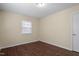 Bedroom with hardwood floors, neutral paint, and natural light from the window at 158 Torain St, Hillsborough, NC 27278
