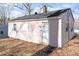 Charming home with white door and frame contrasted against light pink wood siding at 158 Torain St, Hillsborough, NC 27278