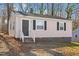 Charming single-story home featuring a stone foundation and traditional siding at 158 Torain St, Hillsborough, NC 27278
