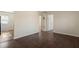 Spacious room with hardwood floors and a white door, ready for your personal touch at 158 Torain St, Hillsborough, NC 27278